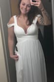 This dress is beautiful in person. It did not look the way I wanted it to on me, as is. I am having the sleeves sewn up different. I thought I would like those sleeves, but I didn't. Personal preference, that's the only reason. Bra area is very supportive!! And it's very slimming. I didn't have anyone to take pics, so I'll show you the awkward weird selfies lol. - Heather E.