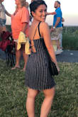 This dress does not have any slack but it is true to size. It was a bit snug around my hips. I love the back details. - Vi L.