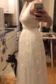 I'm not kidding. I bought a dress that cost about $1,250 and wound up returning it because I liked this one wayyy better. It's beyond stunning and I actually felt like a bride the moment I put it on. 

The only problem was that I didn't have enough self esteem to trust that I could fit into a small even though I'm a very "medium" girl, so I bought the medium and it's HUGE on me. I immediately returned it so that I could buy a small! (In the photo I'm gathering the dress at the back to show what a small would look like on me)

My biggest piece of advice: their sizing runs very true and maybe a little large (which is so refreshing!) so trust yourself! - Patricia B.