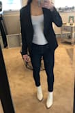 This blazer is a nice quality material with super minimal shoulder padding, but I didn't even realize until I hung it up. I didn't notice while I had it on. This one fit a little bit snug, I'm not sure if I would size up or not though. However I am returning it because I didn't love the style of the lapel and I wanted something a little longer in the back that looked more casual for the office. The hem hit at my waistline, but it was a bit longer in the front. Good for an interview or something formal, but not the look I'm going for! - Cristina G.