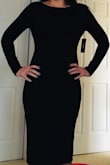 Standing up, the dress looks and feels great. Sitting down, the front of the dress sits tight on the front of your neck and slides off your shoulders. I'm normally a size 4 but ordered a medium so it wouldn't be too tight. It hugs your curves well but the shoulders need to come back more to avoid slipping and the neckline needs to scoop more to avoid choking. Plus every time you walk or sit, the dress rides up, so you have to pull it back down for a smooth appearance again. The material is comfortable. - Melissa H.