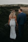 I wore this dress for my elopement in Ireland. It was perfect. The sequins add a heavy richness that I loved. The quality is good and the shape is super flattering. The pattern is gorgeous and hits you in the right spots. The under layer is not as much of a contrast as it looks in the pictures. I'm exchanged it for an XS because it's big around my bust. But the boning and shaping in the bust is perfect, no bra needed with the right fit. Absolutely loved it!! - Chelsea R.