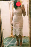 I'm in between a size L and M. However, I was able to squeeze into this with some shapewear. I LOVE the halter top and the dress was very flattering. Love the back as well! I'm 5'0 and my torso is shorter than the average woman. Regardless, this fit me just right! The lace fit detail at the bottom fit me just a bit below the knee so I don't feel like it looks awkward. - Stacey A.