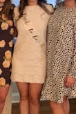 Great dress! I ordered for my bridal shower and got tons of compliments. I am shorter and it hit a few inches above my knees. I will say that I wish I would have gone with a size small to be more fitted, but the dress was still great! - Logan J.