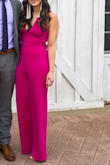 This jumpsuit was so incredibly comfortable and I got so many compliments on it! It does dip a little low in the front, but it was still appropriate for a wedding. The fabric was not thick enough, in my opinion, to go without wearing any type of bra, so I just wore a sticky bra and it was fine.

It does run pretty long, which is great if you're tall, but I'm 5'5" and was wearing 4 inch heels and still had to have it hemmed about 2 inches. I'm usually between XS and S and bottom part fit great, but the top was a little bit loose in the chest area. I probably could have gone with an XS, but just didn't have the time to deal with an exchange. If you're between sizes and smaller in the chest area, I'd definitely size down. However, it still looked great and I did not feel like I was falling out of it. Would 10/10 recommend - the cut and style is so versatile! - Natasha J.