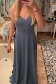 The strap adjustment is limited, luckily much wasn't needed. Snug fit on upper body to accent curves. A little long, but will get tailored. Overall: love it! - Tait V.