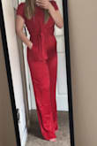 The material is absolutely amazing and it is so pretty. It fits perfectly except for the length, although I was prepared for this and had it hemmed. Now it's perfect!!! So prepare for it running about an inch too long if you're my height and so on. I'm also wearing heels in this picture. - Theresa G.
