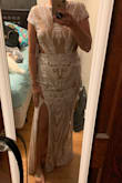 I love it. It is lined with a lightweight satin-y fabric which is very comfortable. The cut outs and slit give a hint of sexy. It fits very true to size. With no shoes on, it hits the floor and I am 5'6". I'll be wearing it for our engagement photos. I did purchase high-waisted shapewear to wear underneath, but quite honestly, it was more flattering without! - Sarah S.