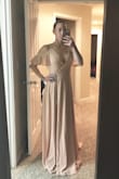 I got an extra small after reading other reviews and it fits great! I have zero hips (actually a 32" and 28" waist) and the wrap tie created a waist for me! Yay !I am wearing this as a bridesmaid and it's perfect. I will need to get it hemmed as it's pretty long, but I expected this when I bought it. - Maria B.