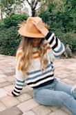So cute! It's a little cropped, but if you wear highwaisted jeans then it's fine. - Laci P.