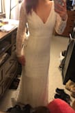 I absolutely love this dress. The fabric is high quality and I love the lace and sleeve details. The mermaid style is perfect and it hugs my curves PERFECTLY! The only thing I'm changing about this dress is the back part has hooks and I'm going to put buttons on to make it look nicer. Overall, I would buy it again. - Amber H.