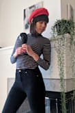 The is definitely a crop top I'm taller, but still it hits at the waist. I do really like how it's hugging, tighter style but comfy and classy. Thin tho, so it will not keep one warm. - Shoko R.