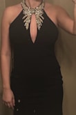 This is a beautiful dress for the price. The beading looks so detailed in person. I ordered a size medium and will probably have it taken in a little around my mid section so I feel secure enough to go without a bra. - Whitney F.