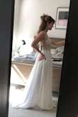 YOU CAN'T BEAT THIS DRESS FOR THE PRICE!!! Seriously. I bought this dress b/c my actual wedding dress was in alterations and after my second fitting (and $350 later), I was really nervous about how it was fitting. I bought this one as a backup. Fortunately, my original wedding dress came back and is looking good, so there is no need to keep this. BUT. Had I had known about this dress earlier on in the dress hunt, I would have 100% gotten this dress. Aside from being a little long even with 1.5" heels on, it fit perfectly and was super flattering. I'm actually sad to be returning it, but just don't have a need for it. - Danielle F.