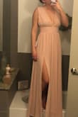 I am smaller chested and I had to go down to the XS because the top was so huge on me. It's just the way the dress is cut. Pretty dress and great color so I am definitely keeping it! - Megan M.