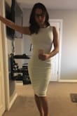 Material has stretch and is very flattering. I wish the liner was thicker as it is a bit see through. I thought the back was going to be even lower. It flattens my booty from the side view but more reason to do more squats! Comfortable, classy and sexy. - Nikki C.