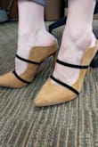 The lack of strap around the back made me nervous about purchasing, but they were so cute I thought I'd try. I'm so glad I did! The fit was super snug across the top of your foot so if you go down just a half size like I did, and there's a tiny lip by your heel, it's just enough to keep the show securely on your foot as you walk. These are so unique, my new obsession! - Crystal B.