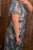 The fit is a little loose but able to adjust with the wrap around strings. The turquoise and white is not as bright and vivid as in the model pictures. It is actually more of a dusky blue giving it more of an old lady kind of feel. Altogether it is a pretty dress. - Kayla R.