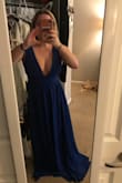 This dress was VERY flattering. It's tight on the ribs but in a good way so that it makes you look skinnier. The material is very nice. I had to get it hemmed because I'm short, but I always do. But seriously love this dress. - Catherine H.