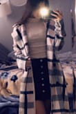 Super cute coat! Very comfortable, this was not at all itchy. It kept me warm but it did fit very long and big. Not as noticeable when buttoned and tied, wish they had it in an xs. - Ariana R.