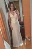 I bought this to wear as a reception dress for my wedding. It's heavy material which I love. I was worried it'd be thin or flimsy, but it's heavy and great quality. Straps are adjustable. It's a little long. I wore it with 2 inch heels, and I was just barely stepping on it. I can definitely walk around okay, but I might get an inch taken off the bottom just to be safe. Overall, I'm in love. It looks beautiful in person- pictures do not do it justice. Only issue would be the length but if you're a little taller, it'd be perfect. - Isha H.