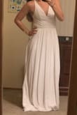 I like this dress and I purchased it for my bridal shower. I'm still on the edge of whether i'll wear it or return it. My only hesitation is that the front is sort of plain and I don't really like how I look in white. Other than that, the back is beautiful and it fits nice. The dress is just super long, but I think that is normal for many Lulus dresses. - Lauren M.