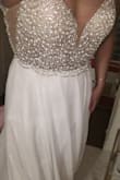 I saw this dress and all the reviews and thought that's how I'd like to look on my wedding day. I ordered two sizes unsure of which would fit better. The 6 came and it fit so well. I look so nice I actually was speechless (rate for me). I can't wait to marry my best friend and see his reaction to me in the dress. I will obviously have to have it shortened and the idea of a bustling option has come up as to how in the skirt. But it's so beautiful. It is very heavy though so hanging it has become a snafoo. Decided to lay in flat for storing it. - Molly O.