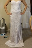 I tried this on as a potential wedding dress and each time I wore it, I loved it even more. Since I have an athletic/straight body type (my hips are actually 32 inches but Lulu's hip choices only go as small as 34), I didn't think a dress as form-fitting as this one would be flattering on me. However, it really accentuates the silhouette of my body nicely. I wasn't too sure about this dress the first time I wore it, but after trying on a few other dresses, this one is definitely the strongest contender! The XS size feels very secure so I'm not concerned about it slipping down (it is perhaps a little tight--the last few inches of the back zipper were difficult to close up but not impossible). The bodice has a nice, firm structure but isn't entirely stiff like an actual corset so it isn't as restrictive as it may seem.
I will need to get it hemmed and the zipper end over my butt is a bit lumpy (time to exercise those glutes!), but I'm very happy with this dress! I will likely accessorize with a nice belt to conceal the line on my midriff. - Akemi I.