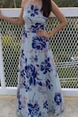 The background of the print is not white as it appears in the picture. It's mostly gray/light blue. I loved it even better! The dress was too long for me, which I expected since I'm a short person, so I just had it hemmed and it was perfect. - Mayra H.
