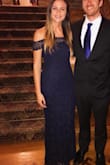 The material in the arms doesn't allow much movement, but I knew that from reading the other reviews. The quality of the dress is amazing, and it was long enough for me even though I'm so tall. I received lots of compliments in this dress! - Danielle K.
