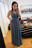 It's very beautiful. Upset about a couple of things: HAD a surprise 55$ duty fee for this dress, which considering it was already 143$ Canadian, I feel like it's too expensive.
The sizing is tough, because it's a little loose in the bust area and the back. Sizing is tough because I ordered a Medium which is too big but I feel like a Small would've been too tight.
The color is beautiful (darker then pic online). Material is nice. 
**VERY HEAVY DRESS has 4 layers of materials for some reason. I will have to get it shortened its very long. So considering the $$ for alterations and duties I am a little upset. But it is a still a beautiful dress... - Rebecca F.