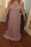 I love it! It is a little loose, but it can easily be fixed. I do wish the zipper in the back also had a clasp, but I will just get that added on. - Elizabeth M.