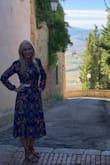 Wore this dress in Italy on our honeymoon! It is so classy and modest but still fun and colorful! Fits true to size and goes great with a belt! Was a little longer on me than the model due to my height but still looked great! - Sarah P.