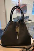 Great quality, even the gold hardware is super nice, big interior I actually love the size! The longer strap is not adjustable like the ad said. I could care less about that but it does hang super awkward probably from where you attach the straps I probably will take them off later. I would recommend this bag though! - Jenna T.