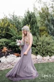 This bridesmaid dress was so pretty - I received many compliments on it! I would recommend ordering a size down. I usually wear a medium in dresses from this site but ordered a small because of my bra size. The small fit me perfectly. If you do have cleavage though, the dress will definitely show it since it's low cut. Overall it was super cute on! - Mackenzie H.