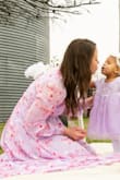 My daughter turned one and we did a Unicorn photoshoot. Her birthstone is purple, so I was trying to find a beautiful purple dress to match her's. I fell in love with this dress on Lulus! However, I ordered a size medium and it was tight on my shoulders and upper back. Typically it would have been a perfect size, however, I have an athletic body and I wasn't quiet comfortable in it. I was able to return it and order a larger size. I ended up ordering the lavender and sage color and I can't wait to get them in! - Tamara G.