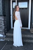 Wow, I do not have enough good words to say about this dress and Lulus. My now husband and I were engaged for only three months before we got married, so the time-frame on finding a dress was about as limited as it gets. I literally googled 'long sleeve, backless, white dress' as this was about what I was looking for (but really couldn't be too picky at that point) and thank goodness this dress popped up. It was more than perfect for what I was looking for, I couldn't believe it. Then there was the ordering process. The live chat on Lulus is so unbelievably helpful, I ordered the dress within about two days of seeing it. Then there is the return policy- absolutely amazing! I ended up ordered XS and S to ensure I got one that fit and ended up returning the S for a full refund. To top it off, the XS fit absolutely perfectly. No word of a lie, I did absolutely no modifications, not even hemming. I got sooo many compliments on the day of my wedding; not only did I love it but so did everybody else. The only weird thing is that the bottom doesn't steam or iron that well. I couldn't even see the few wrinkles though so it didn't matter to me. I absolutely loved the thicker lace up top, and I was able to move my arms all around to dance with my husband and give hugs. Man, I could go on forever. This dress is perfect and the price tag is out of this world. What a huge answer to prayer for my wedding!! Thank you Lulus!!!!!!!!!!!!!!!! - Shelby M.