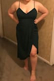 I returned it because I found a dress from a different store that was more flattering. I am heaviest in my stomach, thin in the waist and thick again in the thighs and butt. It was flattering, but the bust was a bit tight and in the front it sort of caused them to bulge out a bit at the top (can't tell in the pic). I ordered the green- it was a gorgeous, flattering color and it did cover some my back fat a little bit, too (though I have apparent rolls in the pic LOL). The slit could go up high if you moved a certain way. - Jennifer L.