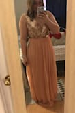 Beautiful dress. Great material. The fit is a tiny bit small around the waist (not stretchable) but it still fits. Zipper is a little hard to move. It flows beautifully. Would buy again. - Michelle B.