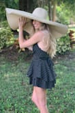 Such a cute and simple romper. You can dress it up with heels or dress it down with sneakers or flats. - Laci P.