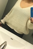 Cute cream color, comfortable but not as long as pictured on the model, which it stated she's 5'9 wearing a small I think. Right below my belly button, kinda like a crop top. Sweater is more rounded shaped, hanging off the shoulder and I guess you can stretch it out to make it longer since it's shorter than expected. - Jasmine K.
