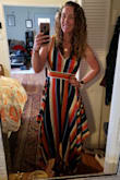 The moment I saw this dress, I knew I had to have it. It's stunning. The colors are just as vibrant in person, and the stripes lengthen your body and make you look taller! The fit is a bit tricky because the material is not stretchy at all. So make sure to go with your exact measurements or just a tad bigger because tight does not work (I originally got the small, and it zipped up but JUST barely, and was not a good look). Other than that, it's outstanding. Can be worn for a more casual occasion with a jean jacket and sandals (I wore it for a date on the Santa Monica pier), or dressed up with heels for a night out. The handkerchief hem is gorgeous and shows just a bit of leg when you walk, making it extra sexy. Highly recommend! - Ramona V.
