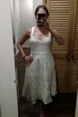 I ordered the Large and the waist was too big, the straps were too long, and the top was flat. What I mean by that is that the top didn't have cups in it, it just kind of smashed my chest and was not flattering. It was pretty frumpy. In addition, the zipper was very difficult to get up and down because of the lace near the zipper. I returned this one. - Christina M.