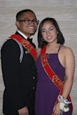 I wore this dress for a military ball. I got so many compliments and everyone loved the back. The color is a nice and rich purple, it might show a different shade depending on the lighting. You can tell it's made out of high quality material because of the weight of the dress. Due to my height it was excessively long, I cut about 4 inches off the bottom, wore 2 inch heels and the dress was right above the ground. I got away without wearing a bra, it's preferable if you got the sticky cups. If you are petite, you should get this dress ahead of time to make alterations. Beautiful dress!! - Sandy S.