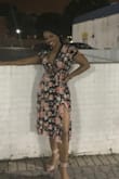 This dress is beautiful in person. However, it runs large so I had to get alterations to fix the length and the slits. Once it was altered it fit perfectly. It has become one of my favorite summer dresses. - Jennifer