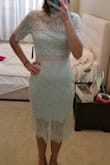 The dress was a little loose on me. I could have sized down to an XS. Material felt great and light weight. I returned the dress it was beautiful but not right on me - Sara N.