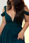 Bought Thais for a bridesmaid dress. The material has a nice weight, is good. Look simple, but sexy. - Maria L.