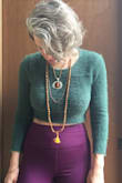 Gorgeous color! This is a super stretchy, soft, fuzzy, cropped sweater. Ideal to wear with high-waisted bottoms or as a warm layer over a fitted dress. I ordered a Small because I wanted a fitted look, but I'm guessing a Medium would have fit just as well with a little more room. I am busty so the sweater sits higher on me above my natural waistline. I absolutely love this number and highly recommend it! - Corrine B.