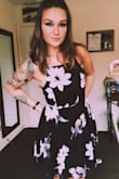 The material isn't stretchy except at the bottom band around the hip. Nice flare to accommodate hips, mostly pay attention to the waist measurement for this dress because that is where it doesn't have a ton of give! Also, the lace up in the back is adjustable mostly, there are a couple straps that can pinch if it's too tight! Love love love, super flattering and flirty and feminine. - Sarah L.