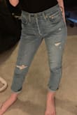 I typically wear a 25 in jeans, but I maybe should have gone with a 24. There isn't a zipper, but instead a row of buttons, and they can kind of make the front look bulky at times. Still cute "mom" jeans though. - Caelyn H.